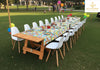 Brown Wooden Table and Scandinavian Chairs for 20 Kids