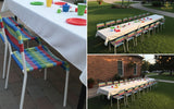 White Covered Tables and Rainbow Chairs for 20 Kids